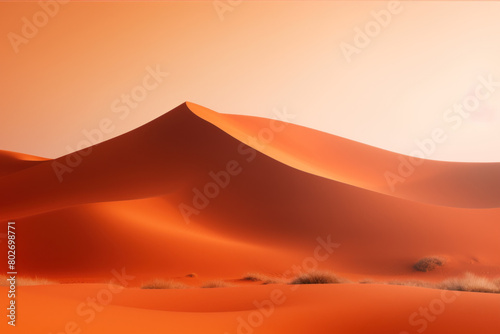 Smooth flowing lines of desert dunes under an orange sunset  capturing the quiet solitude and expansive beauty of the desert.