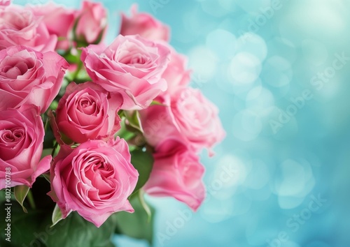 Elegant Pink Roses Bouquet on Soft Blue Bokeh Background for Special Occasions