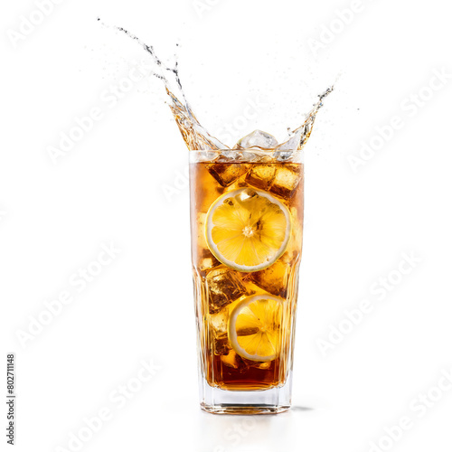 Iced tea with lemon wedges tea leaves and ice cubes in motion inside a tall
