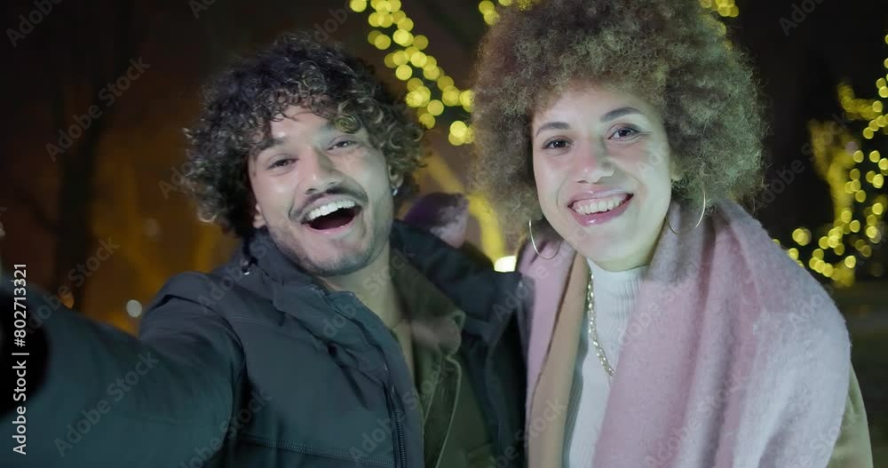 POV Happy cheerful friends making video call standing on garlands and lights background - New Year holidays Christmas vacation POV Happy cheerful friends making video call standing on garlands and lights background - New Year holidays Christmas vacation
