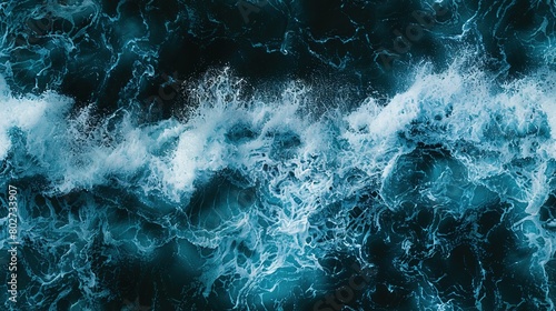 Fototapeta Naklejka Na Ścianę i Meble -    A vast expanse of water adorned with countless wave caps and an abundance of white foam