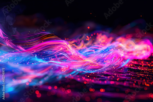 Energetic neon waves crashing in a vibrant explosion of color and light. A dynamic display on black background.