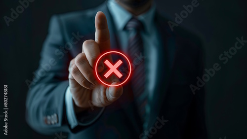 Businessman touching holographic cancel icon.