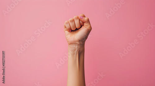 Raised fist of a women for international women day and the feminist movement.