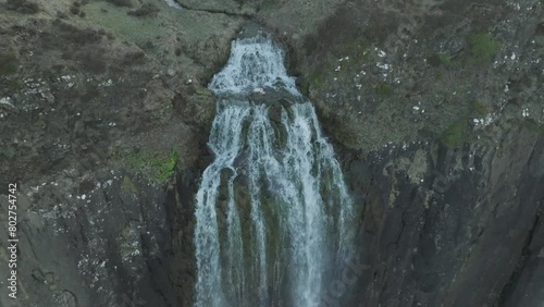 Slow aerial establishing shot of the famous Mealt Falls on the Isle of Skye photo