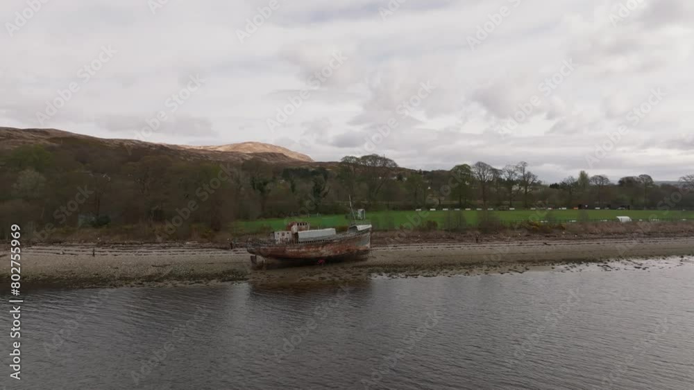 Aerial closing shot of tourists walking around the Corpach Shipwreck Aerial closing shot of tourists walking around the Corpach Shipwreck