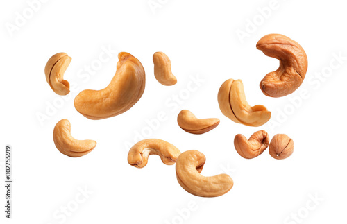 Scattered cashew nuts float on a transparent background. Generative AI