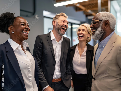 Group of diverse office workers having a laugh together