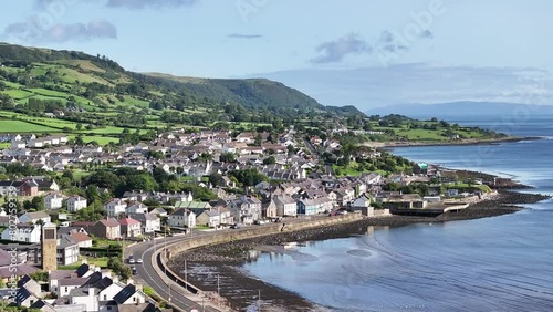 Carnlough on The Antrim Coast Road in Northern Ireland. Part of the Causeway Coastal Route. Aerial 50fps UHD photo