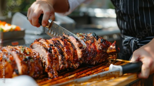 A chef carving into a whole grilled pork neck, revealing tender and flavorful meat beneath the caramelized surface.