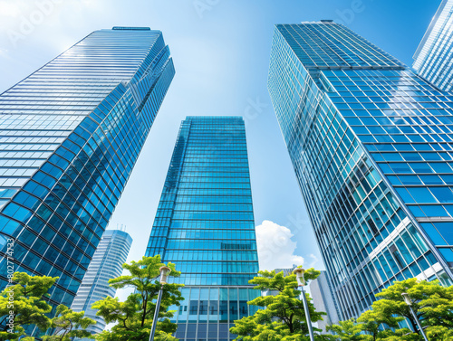 Three tall buildings with a clear blue sky in the background