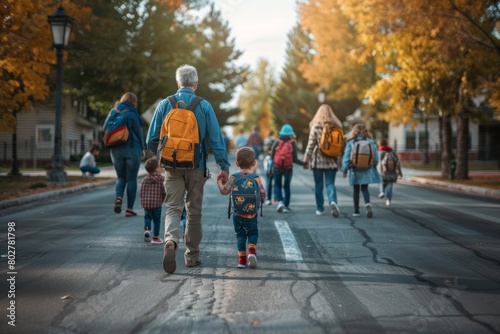 A back view of an American parents in the morning rush dropping kids off at school photo