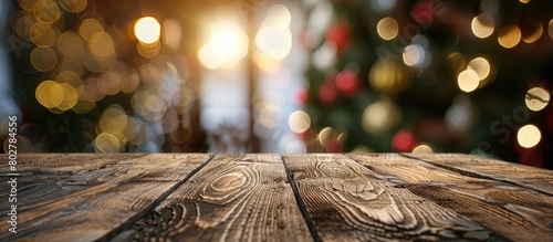 An empty wooden table set against a blurred winter holiday backdrop.