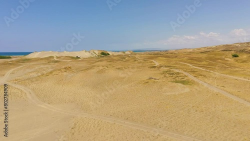 Top view of Paoay sand dune. Sand dunes near to the sea with sky. Ilocos Norte, Philippines. photo