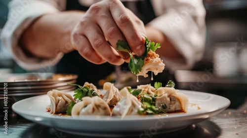An Indian chef garnishing a plate of vegetable momos with fresh cilantro leaves and a drizzle of tangy sauce, adding the final touches.