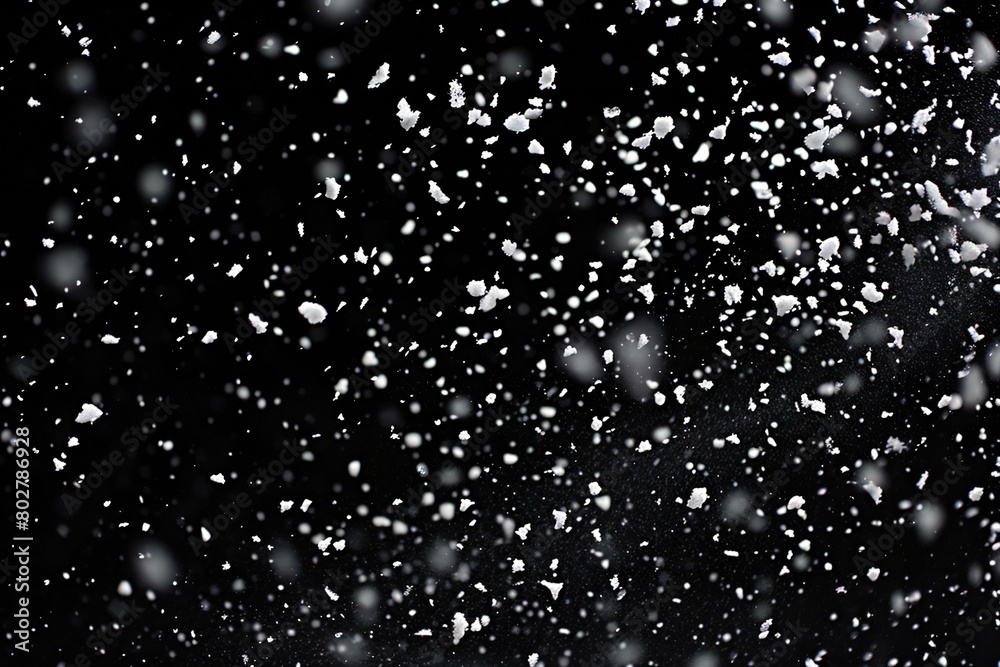 Snowflakes on a black background,  snowfall in the dark