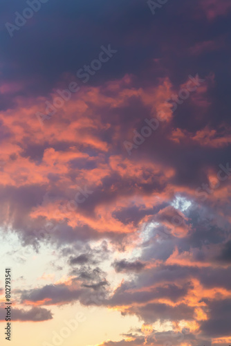 Stunning sunset clouds in vibrant shades of purple and orange, ideal for dynamic and emotional advertising, design, and social media