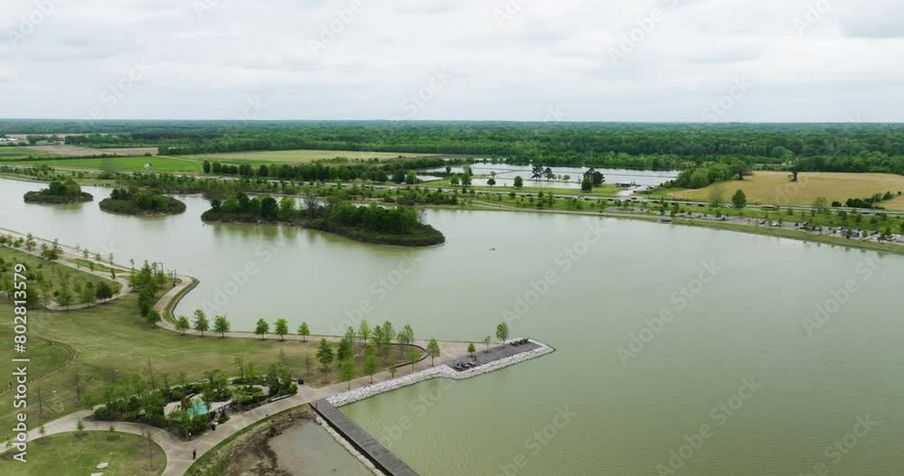 Shelby farms park with lush greenery and multiple lakes, memphis, tennessee, on a cloudy day, aerial view