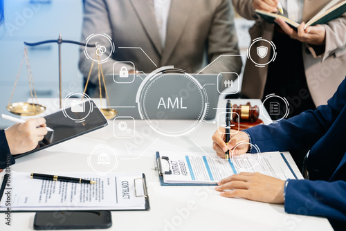 AML Anti Money Laundering Financial Bank Business Concept. judge in a courtroom using laptop and tablet with AML anti money laundering photo