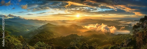 a stunning sunset illuminates the majestic mountains, framed by lush green trees and a clear blue s