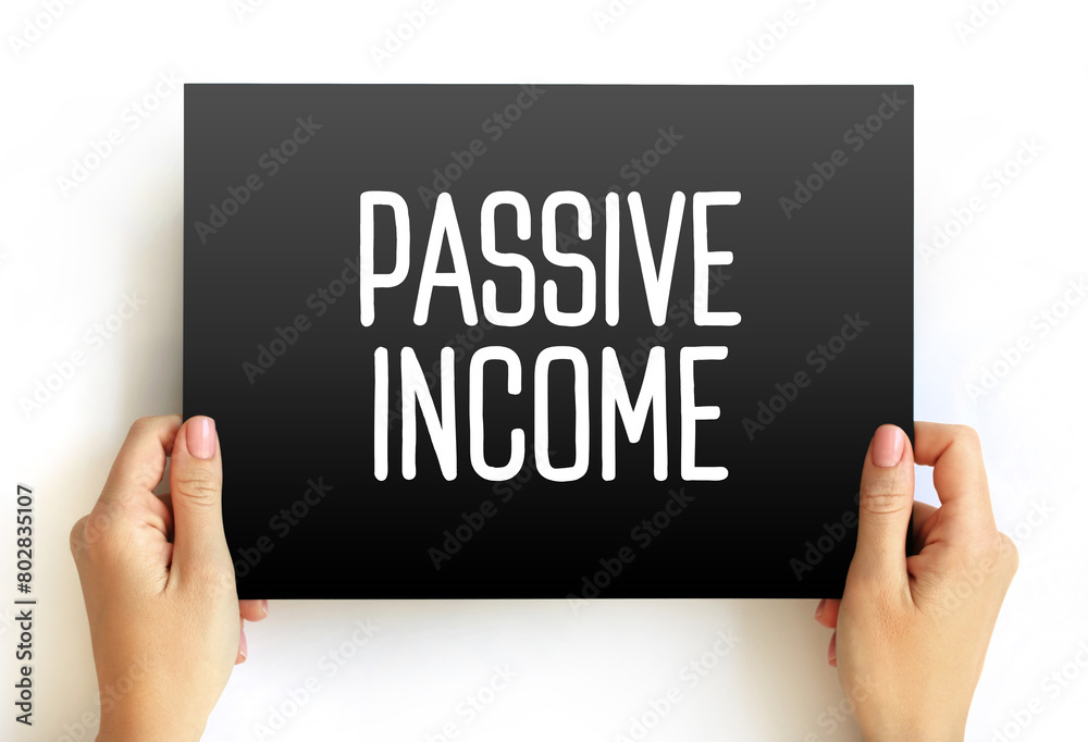Passive income - regular earnings from a source other than an employer or contractor, text concept on card Passive income - regular earnings from a source other than an employer or contractor, text concept on card