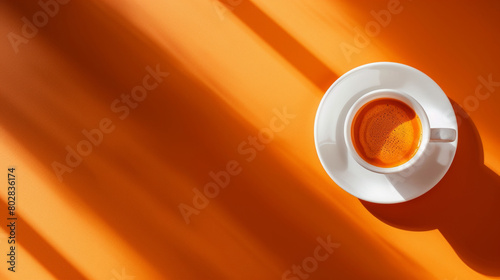 a cup of coffee orange background.