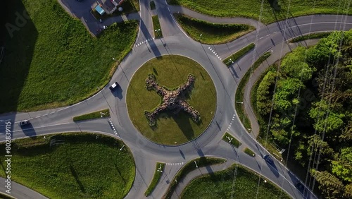 Aerial static view of unique roundabout intersection.  Colorful cars. photo