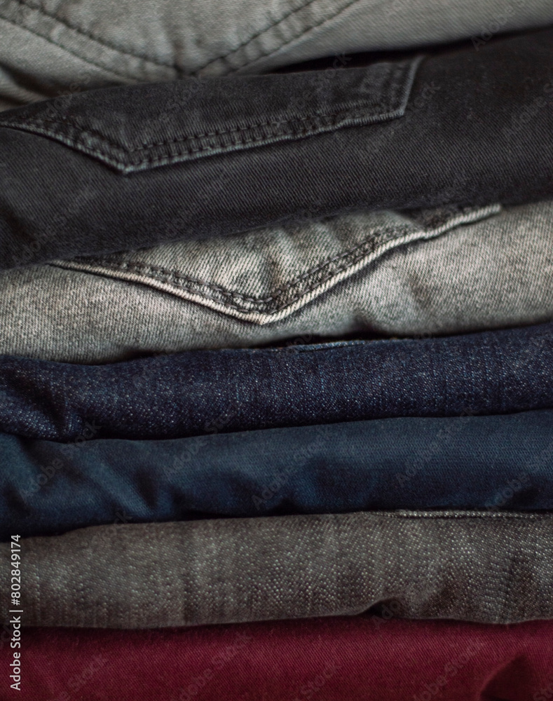Stack of jeans, close up texture