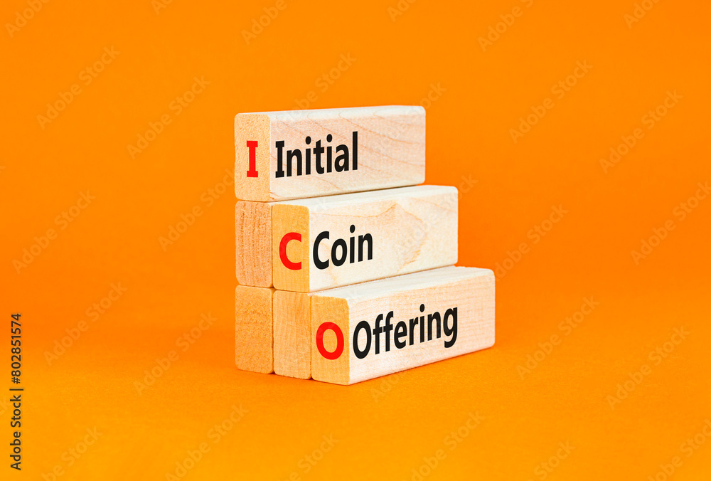 Naklejka premium ICO initial coin offering symbol. Concept words ICO initial coin offering on beautiful wooden blocks. Beautiful orange background. Business ICO initial coin offering concept. Copy space.
