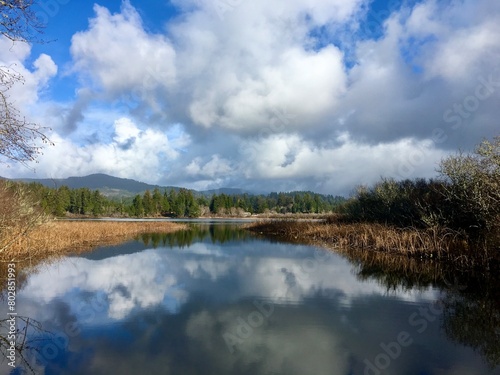 Stunning skies mirrored on tranquil Sutton Lake waters, in Florence, Oregon