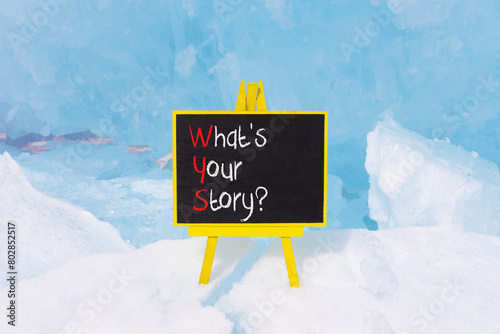 Storytelling and what is your story symbol. Concept words What is your story on beautiful yellow blackboard. Beautiful blue ice background. Business storytelling what is your story concept. Copy space