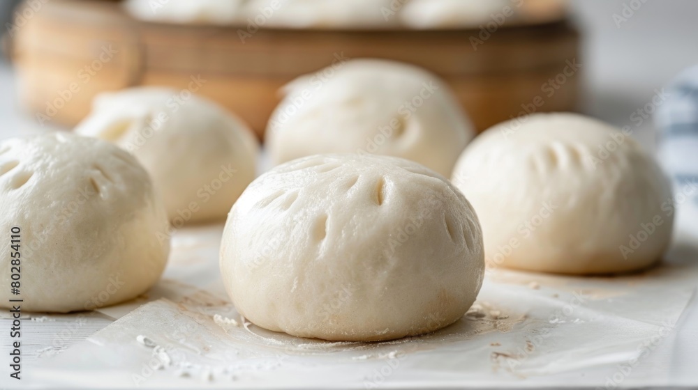 Fresh steamed buns on a marble countertop. Food photography suitable for design