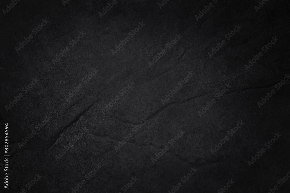Naklejka premium Dark gray black slate stone wall texture background in natural pattern for decorative interior and exterior.
