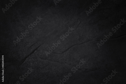 Dark gray black slate stone wall texture background in natural pattern for decorative interior and exterior. © Tumm8899