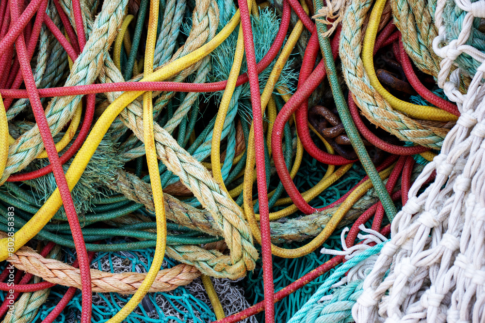 multicoloured trawl ropes and nets with drawn ropes and footrope