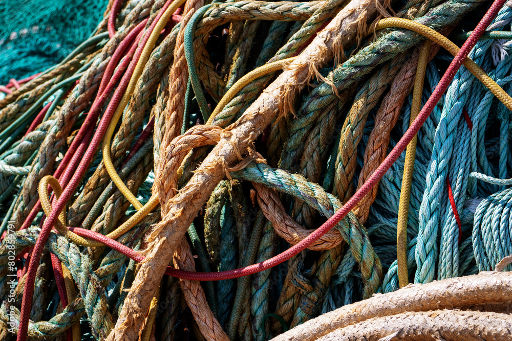 red, white and blue trawl ropes and nets with drawn ropes and footrope