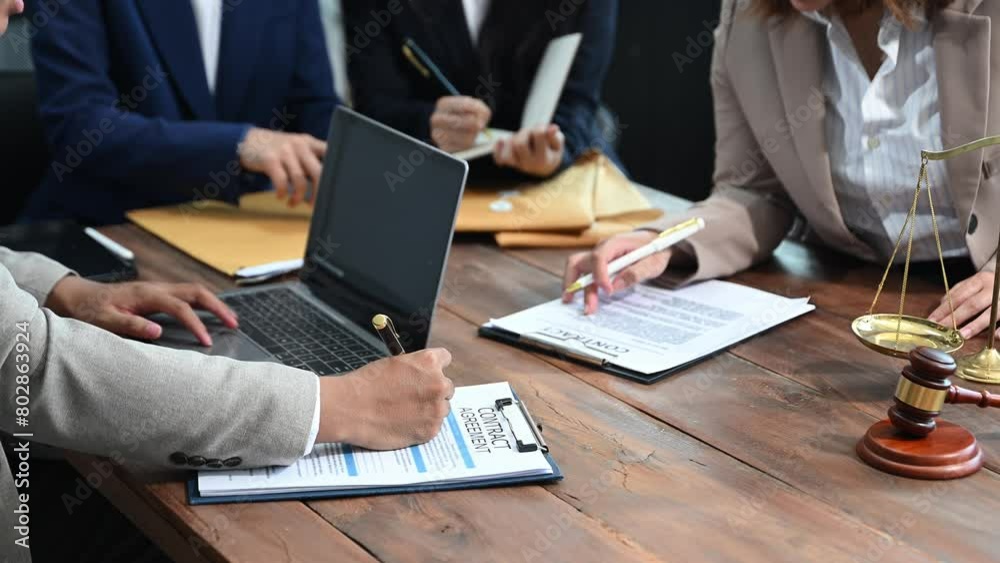 business people and lawyers discussing contract papers sitting at the table. Concepts of law, advice, legal services. business people and lawyers discussing contract papers sitting at the table. Concepts of law, advice, legal services.