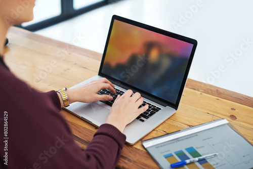 Woman, business and hands with laptop in office to analyse income chart or strategy graph tor review financial report. Corporate, people and paper for research with statistics for company growth
