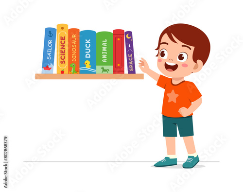 little kid take a book from bookshelf