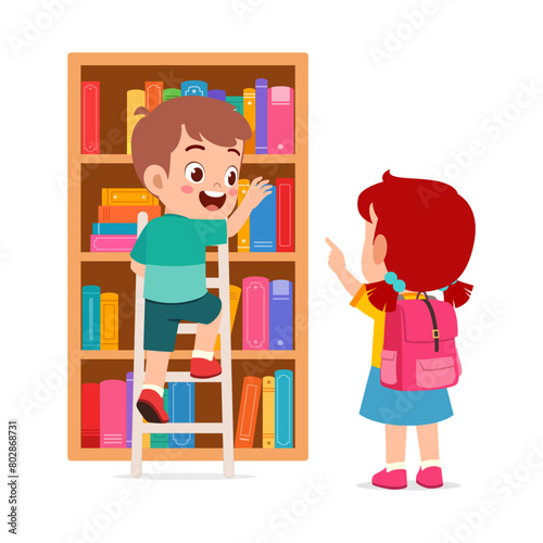 little kid and friend take a book from bookshelf using ladder