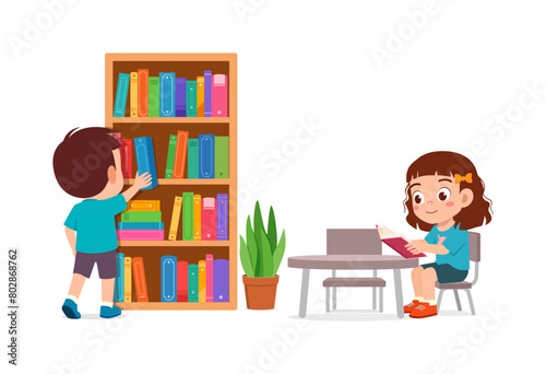 little kid read book in the library with friend