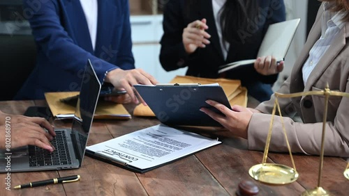 business people and lawyers discussing contract papers sitting at the table. Concepts of law, advice, legal services.