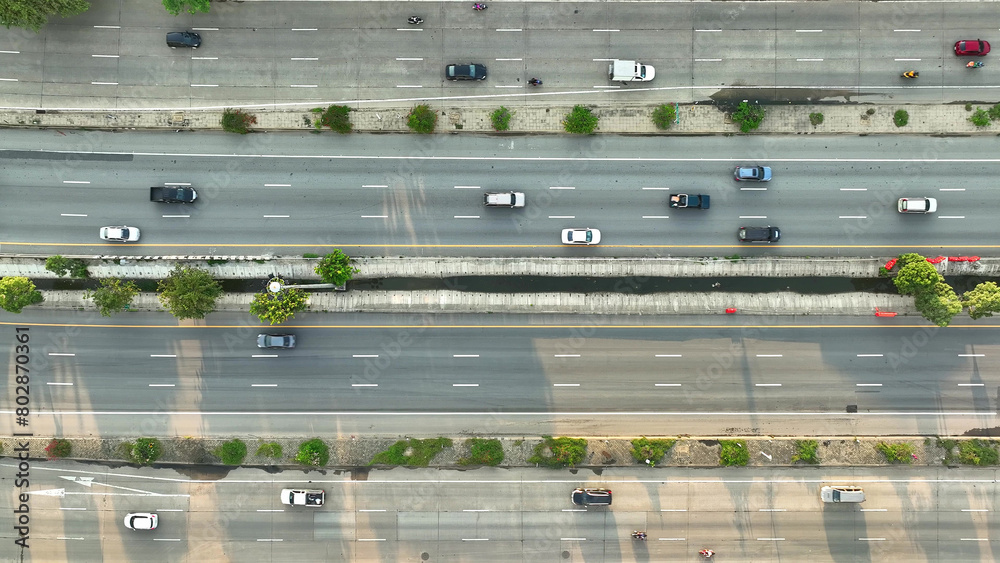 The drone's eye view reveals a bustling ant colony of cars, navigating the intercity motorway, forming intricate patterns during the hustle and bustle of rush hour. Roads background.
The drone's eye view reveals a bustling ant colony of cars, navigating the intercity motorway, forming intricate patterns during the hustle and bustle of rush hour. Roads background.