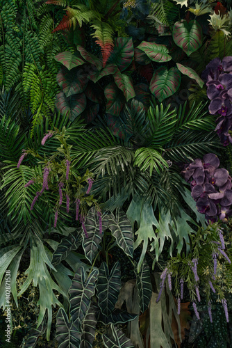 Tropical green leaves background, Nature Wall Lush Foliage Leaf Texture, Vertical image. © Nabodin