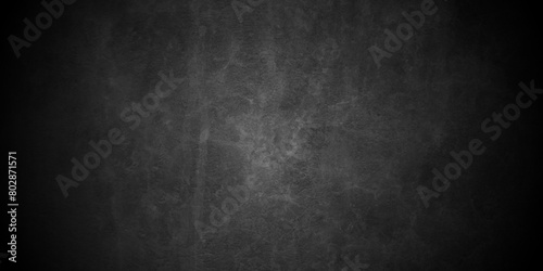 Old dark black stone wall grunge backdrop texture background. monochrome slate grunge concrete wall black backdrop vintage marbled textured border background.