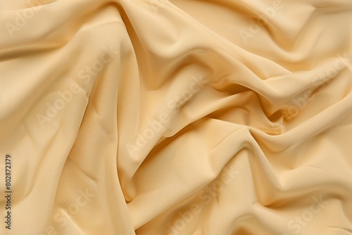 Smooth Golden Silk Fabric Texture Elegance Background photo