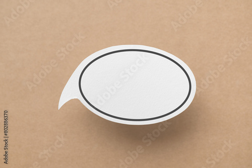 Conceptual image about communication and social media, customer feedback, real blank white speech bubble paper cut on grunge brown color background