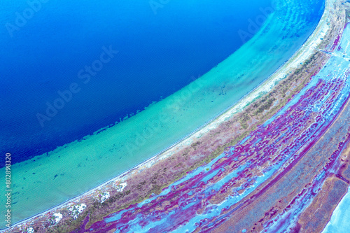 Abstract nature background. Top view of the bottom of a dry estuary. Colorful ground texture © vvvita