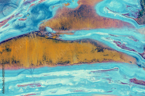 Abstract nature background. Top view of the bottom of a dry estuary. Colorful ground texture © vvvita