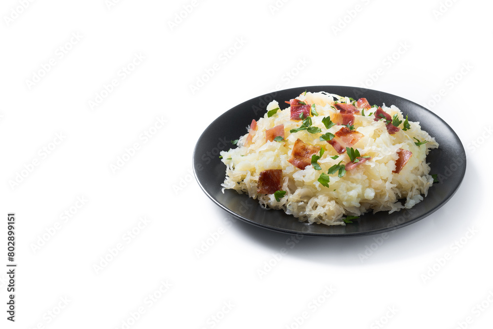 Slovak potato dumplings halusky with steamed sauerkraut and bacon isolated on white background. Copy space Slovak potato dumplings halusky with steamed sauerkraut and bacon isolated on white background. Copy space